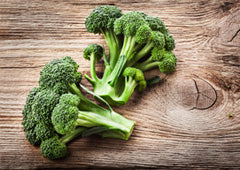 Broccoli on wooden table