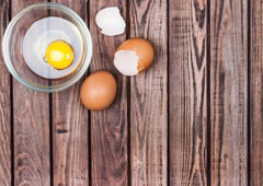 Fresh chicken egg cracked into a bowl