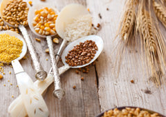 Grains and corn in spoons