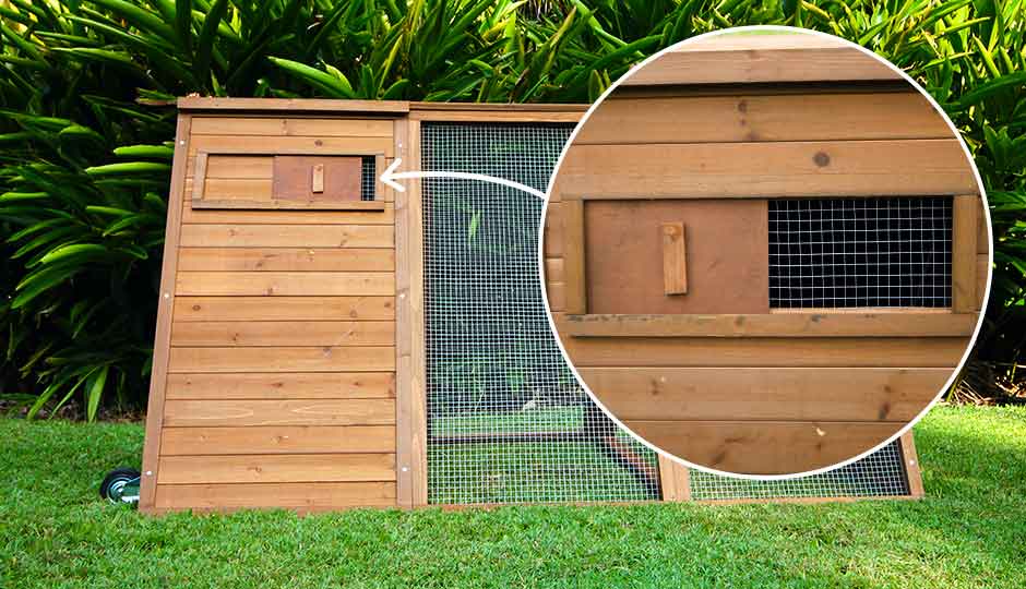 cluck house chickne coop back view of sliding window for ventialtion