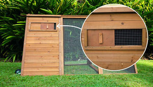 cluck house chickne coop back view of sliding window for ventialtion