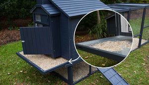 painted outdoor rabbit den with cleaning trays