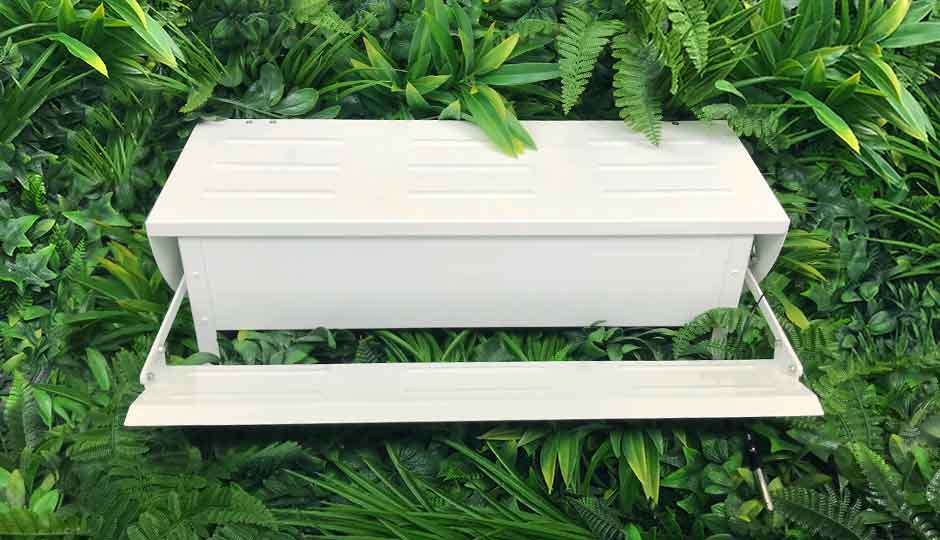 white painted treadle feeder and drinker