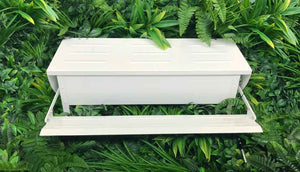 white painted treadle feeder and drinker