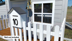 close up of letter box and picket fence on bed and breakfast chicken coop
